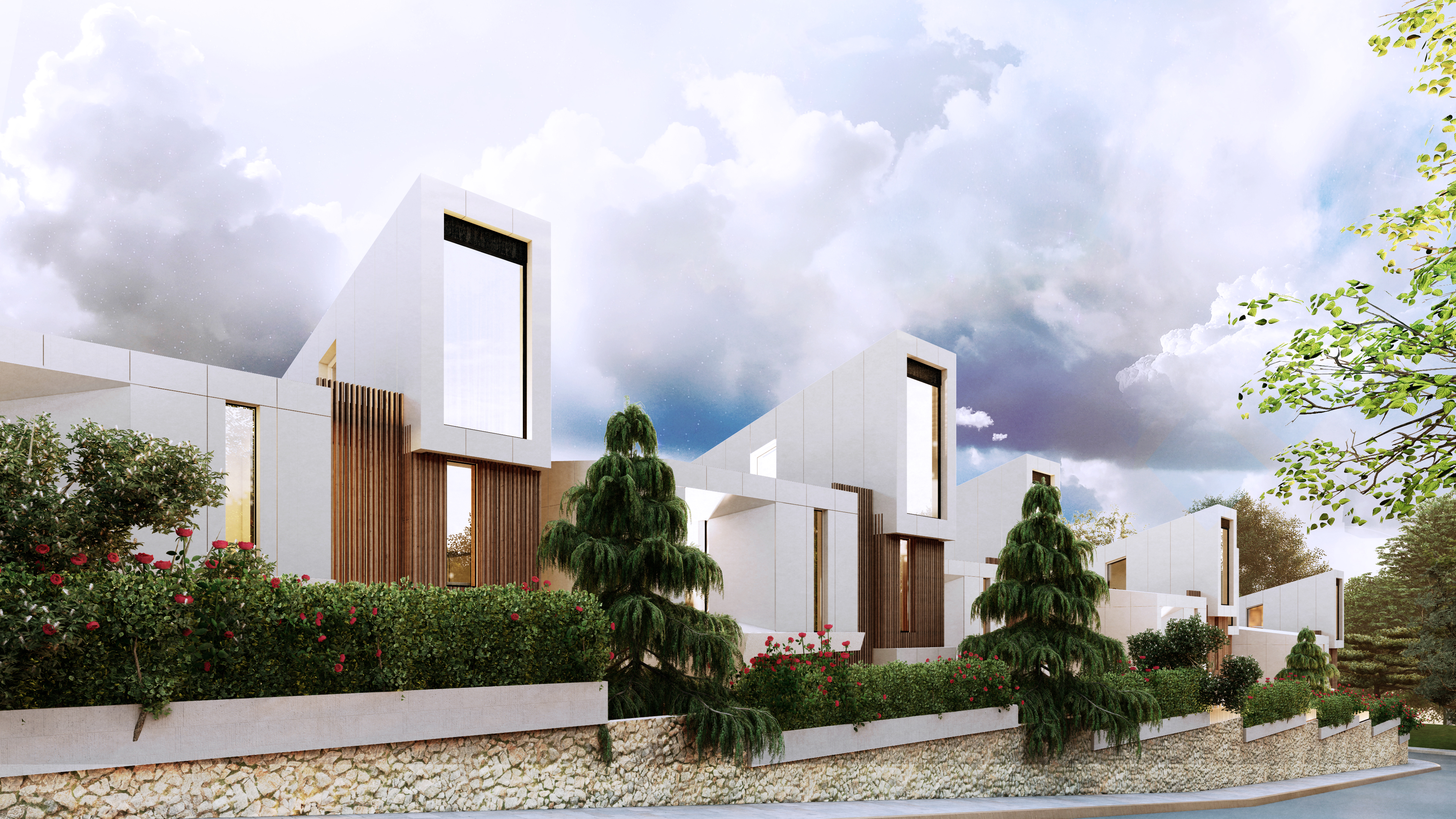 Street view of Perla Garden, Tirana, white angular houses behind a hedge and stone boundary wall