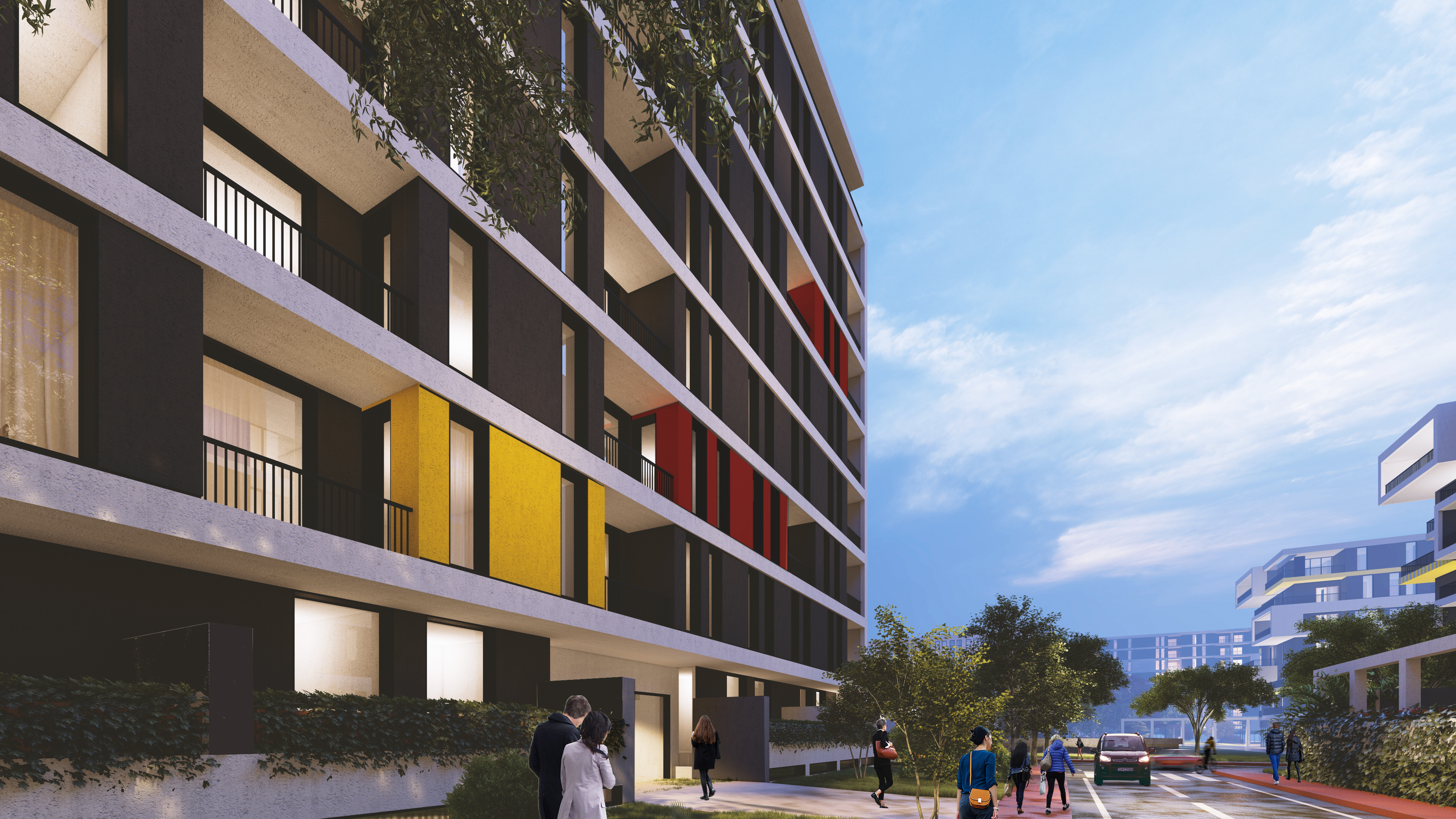 Close view of the ALES facade in Tirana, yellow and red panels between the balconies