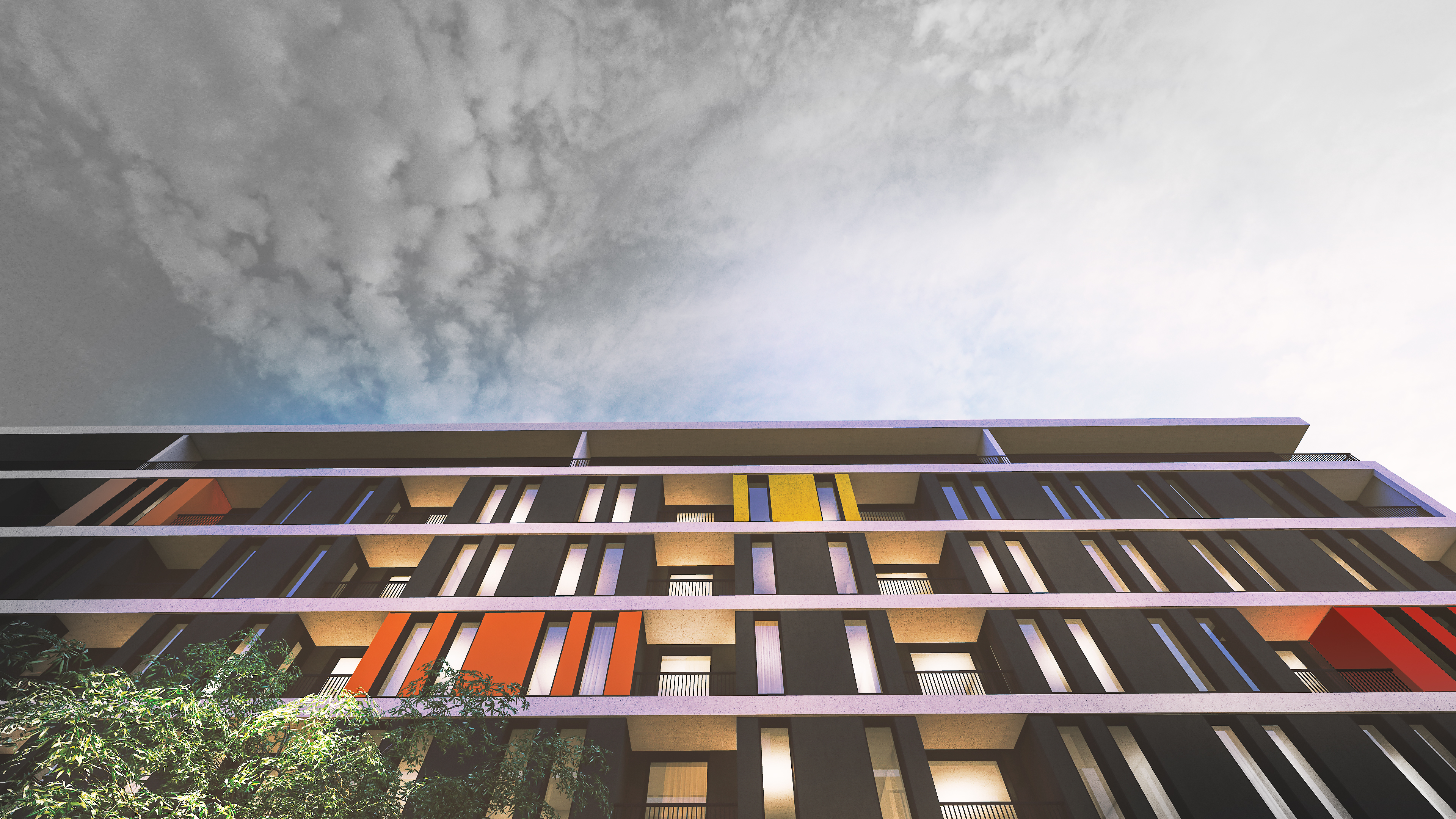 Looking up the ALES facade in Tirana, coloured panels stepping across the balconies