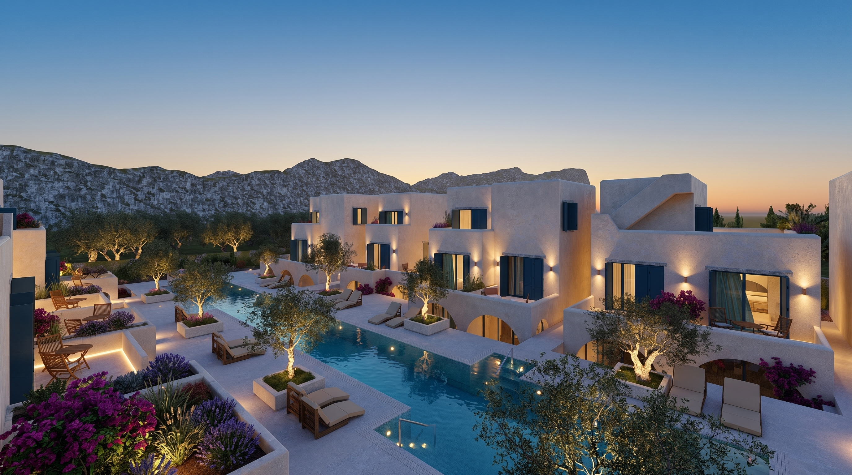 The Aquamarine resort at Qeparo at dusk, villas and pool set against the mountains